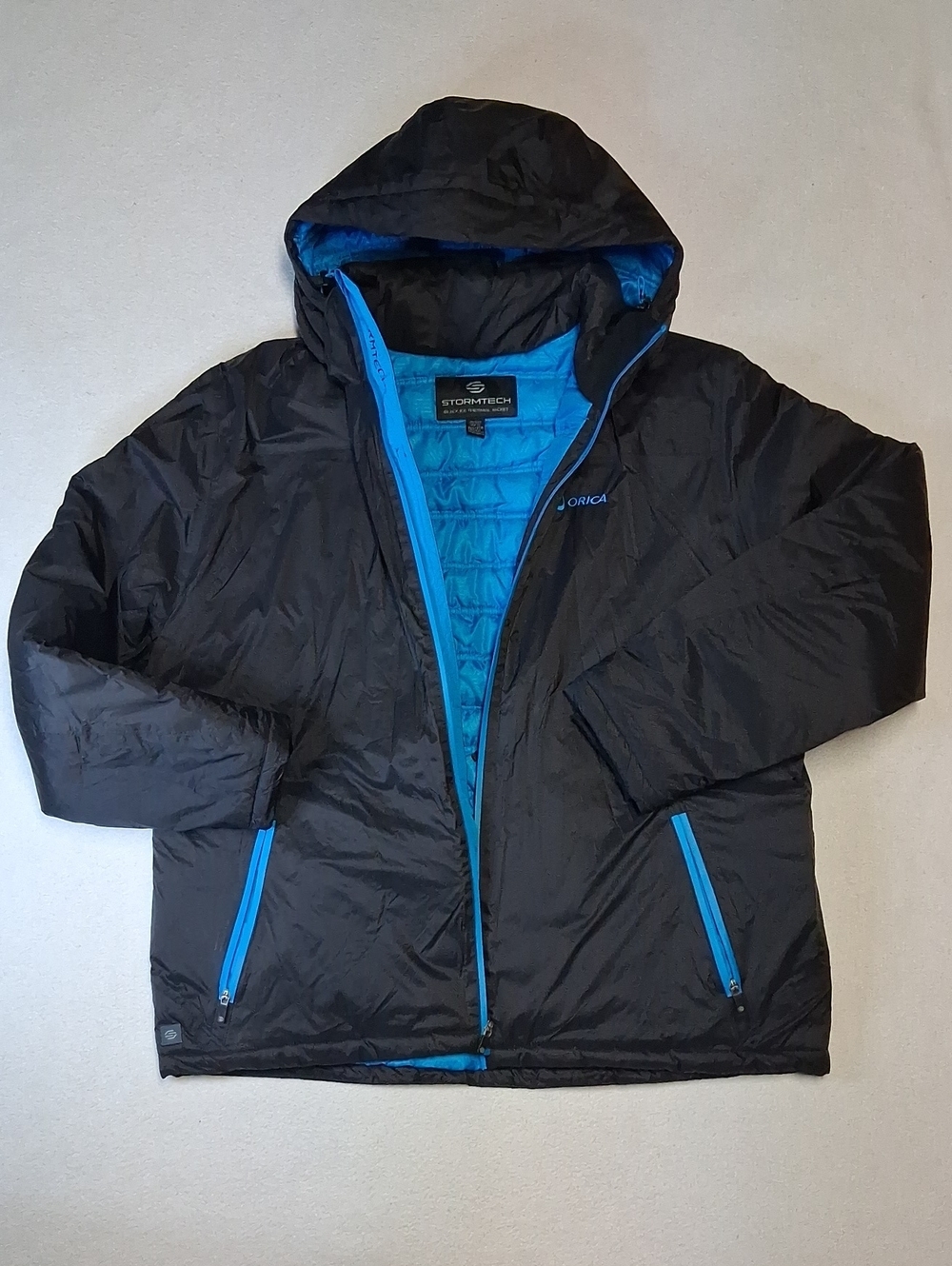Stormtech Men’s Black Puffer Jacket with Bright Blue Lining